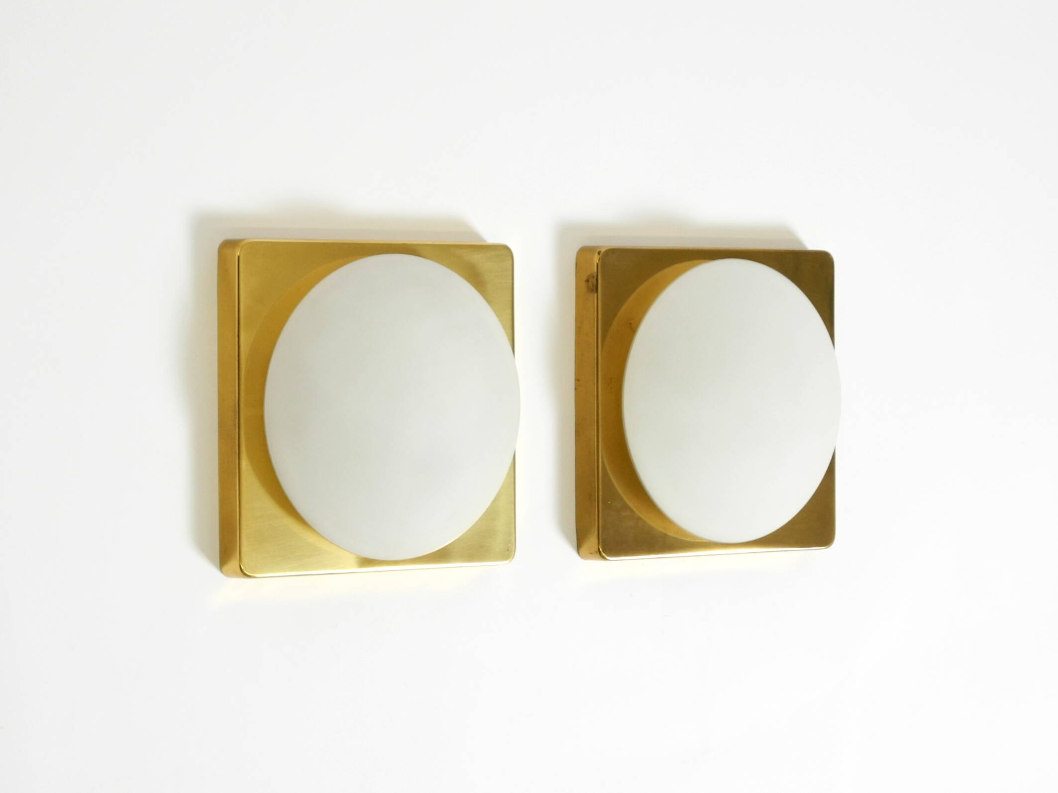 Two 1970s brass wall lamps by Rolf Krüger for Heinz Neuhaus Leuchten