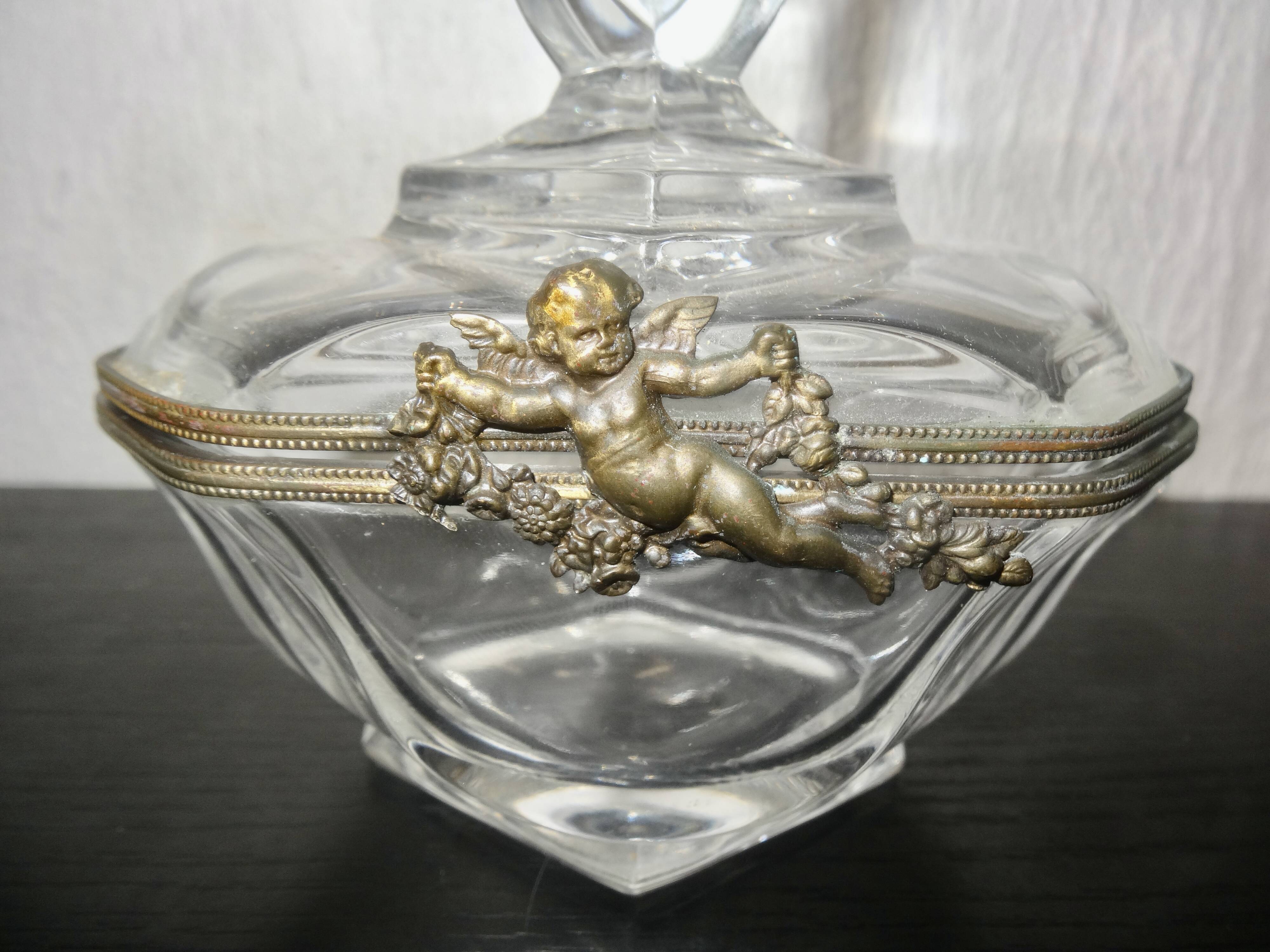 glass jewelry box with brass cherub decoration