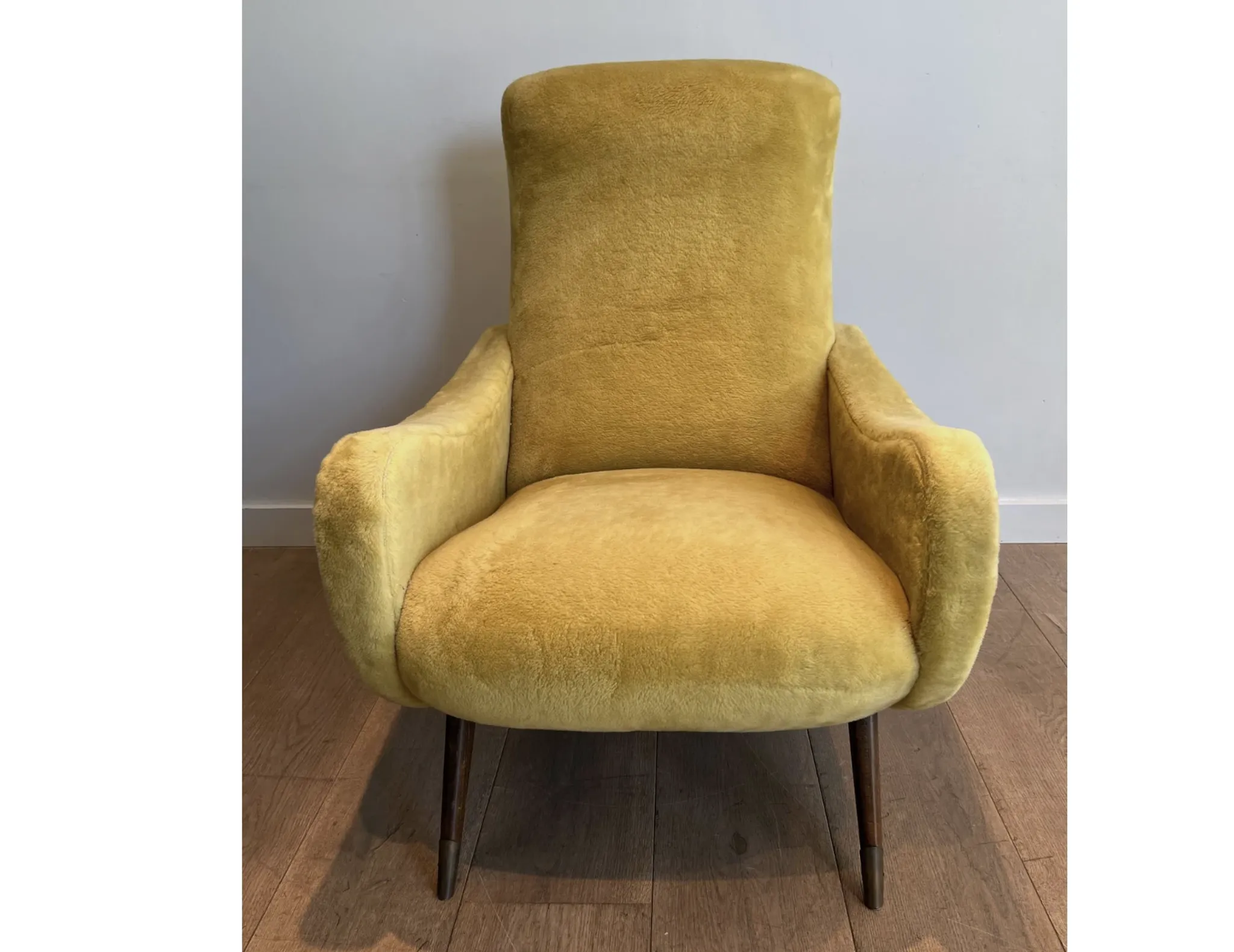 Two designer velvet armchairs from the 1960s in yellow.