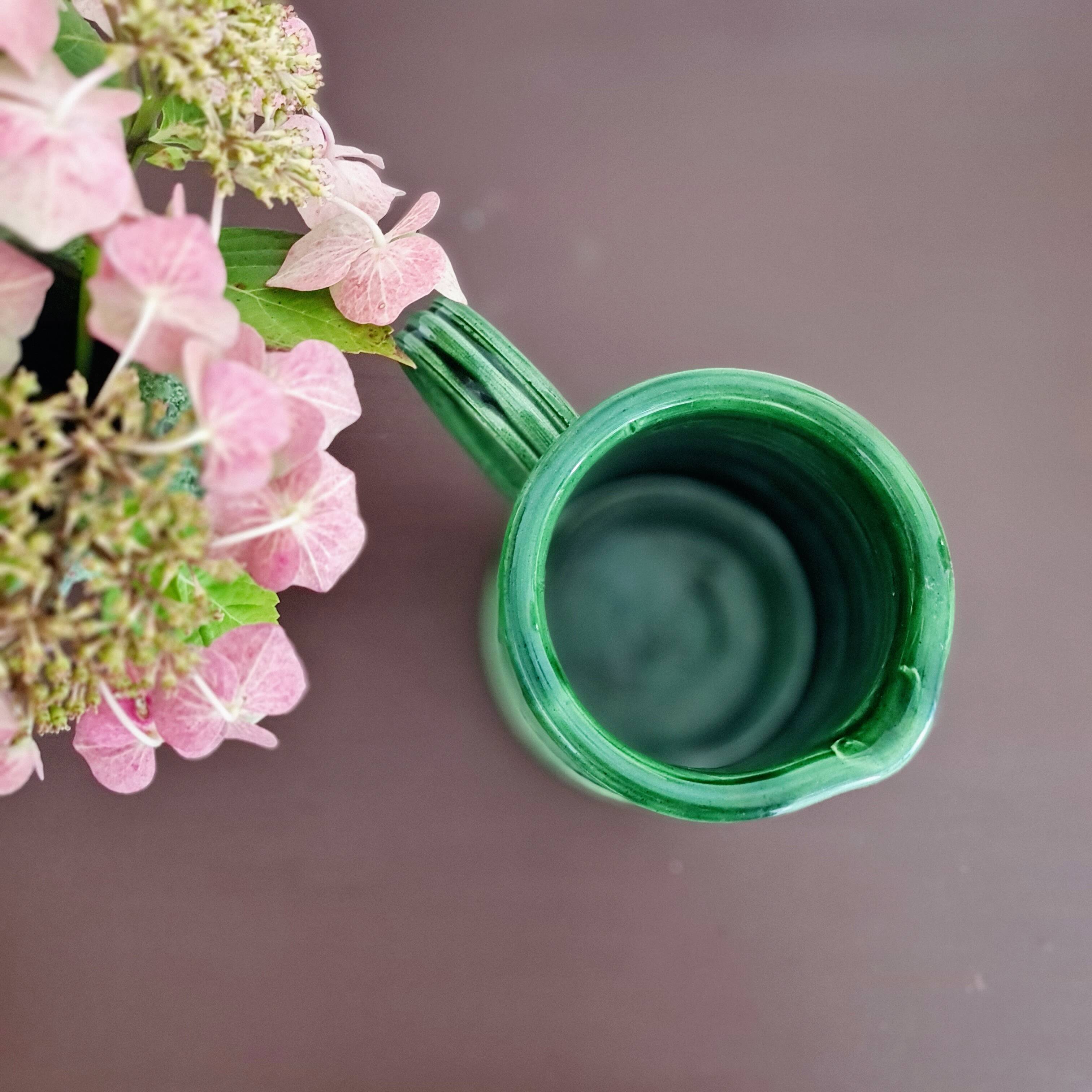 Green glazed terracotta pitcher