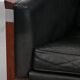 Black Art Deco cowhide leather and wooden design armchair with a high back