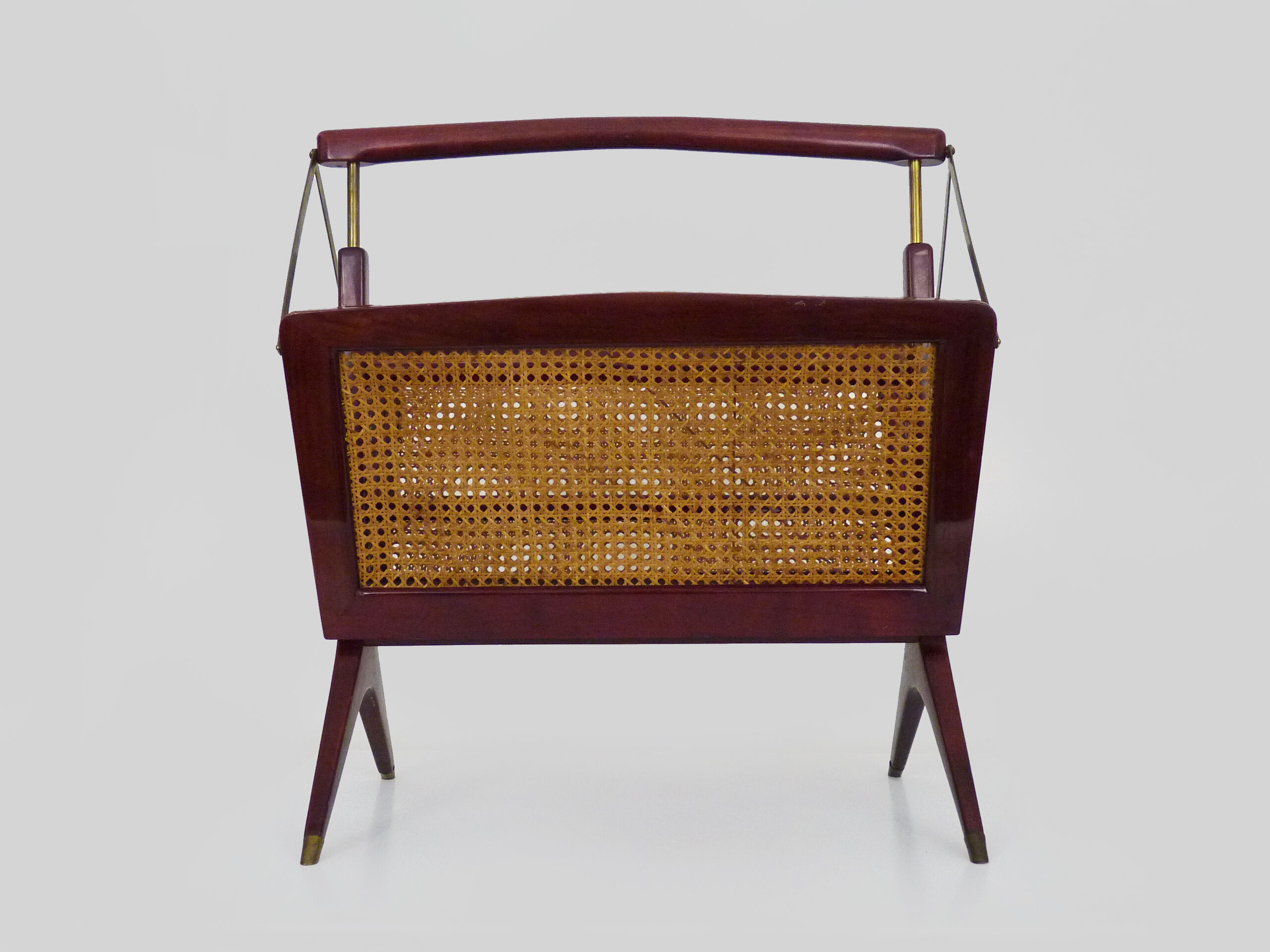 Magazine holders, italy, 1950s. walnut, canage, brass