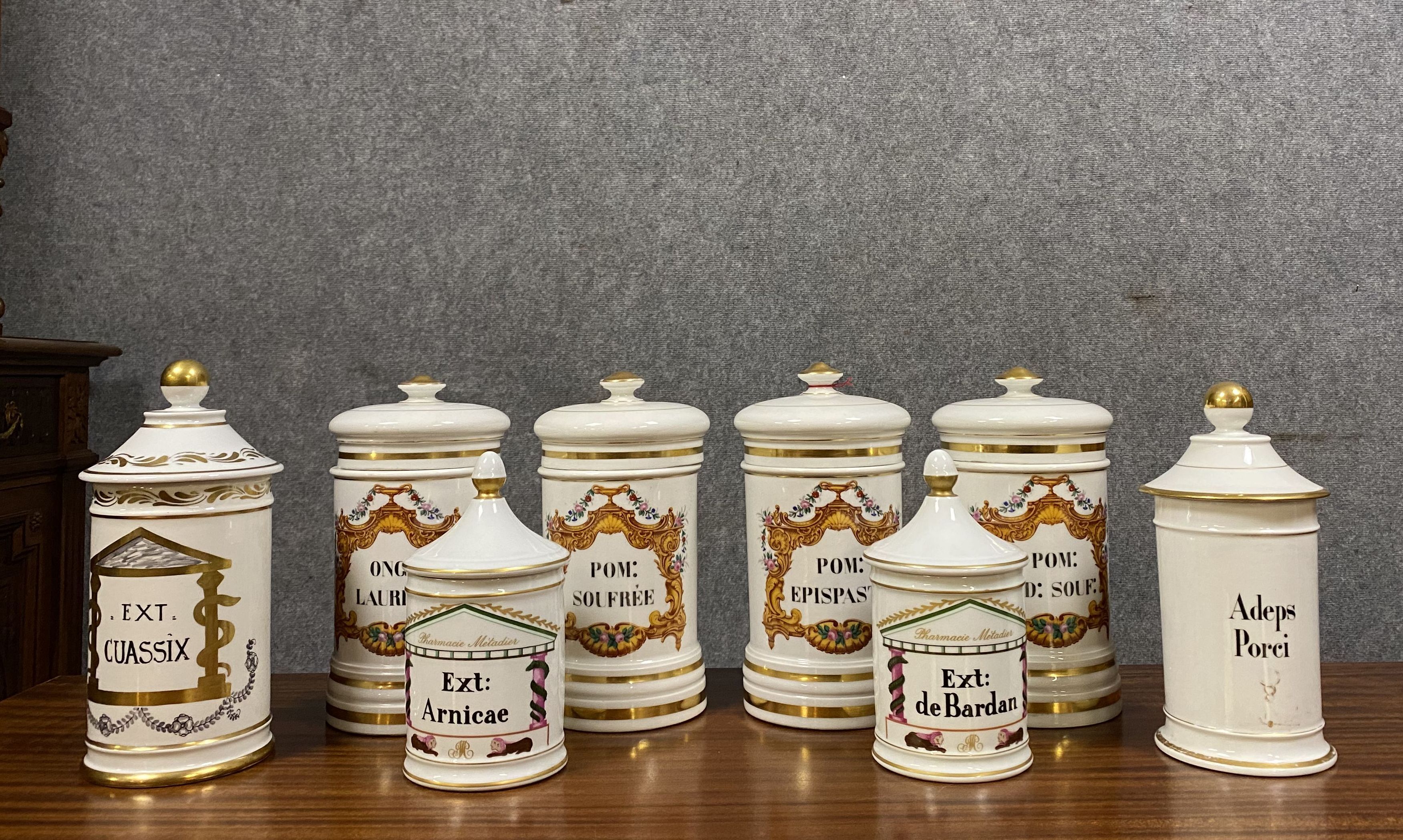 Set of 8 Paris porcelain pharmacy jars with white background with gilding