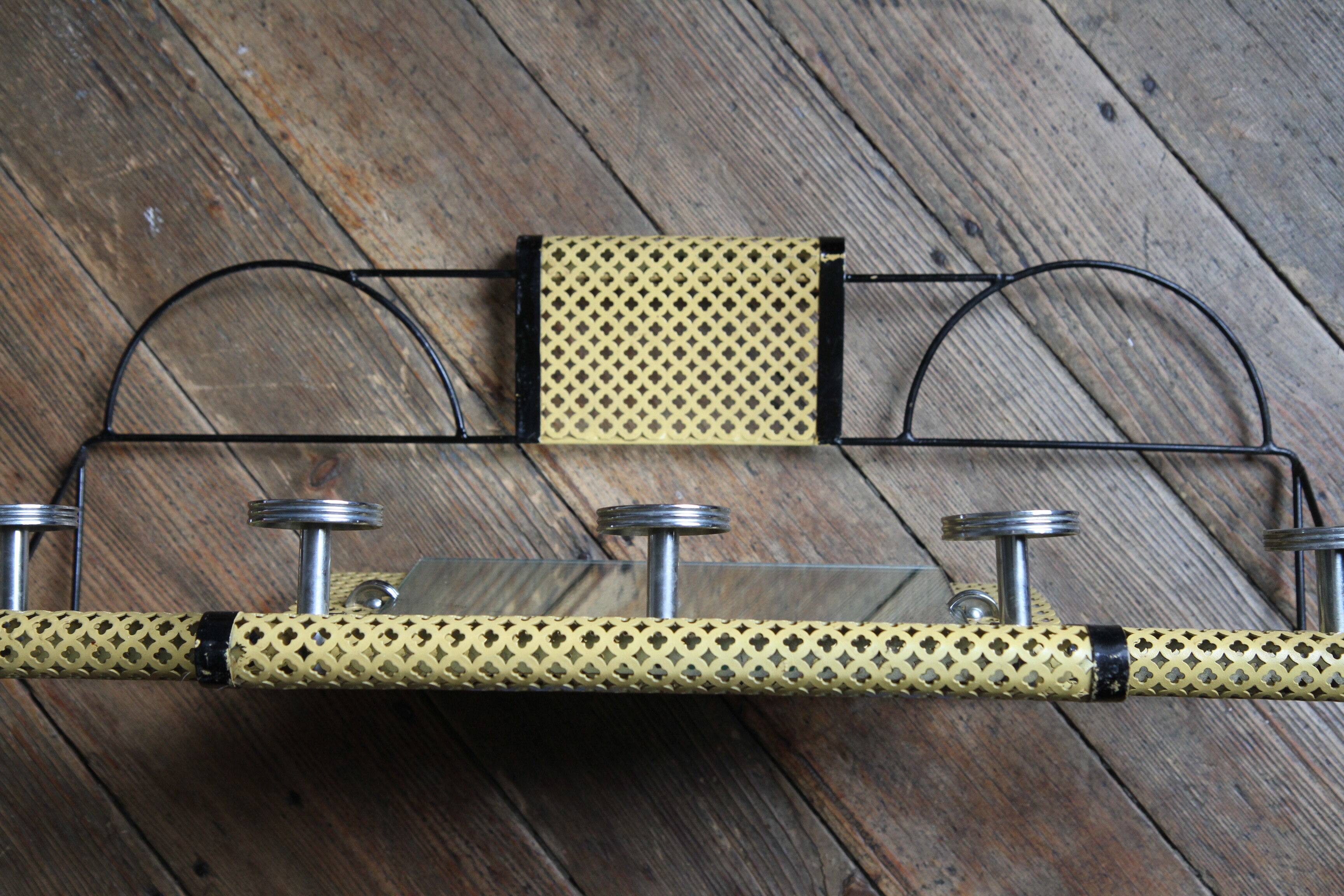 1950s perforated metal coat holder