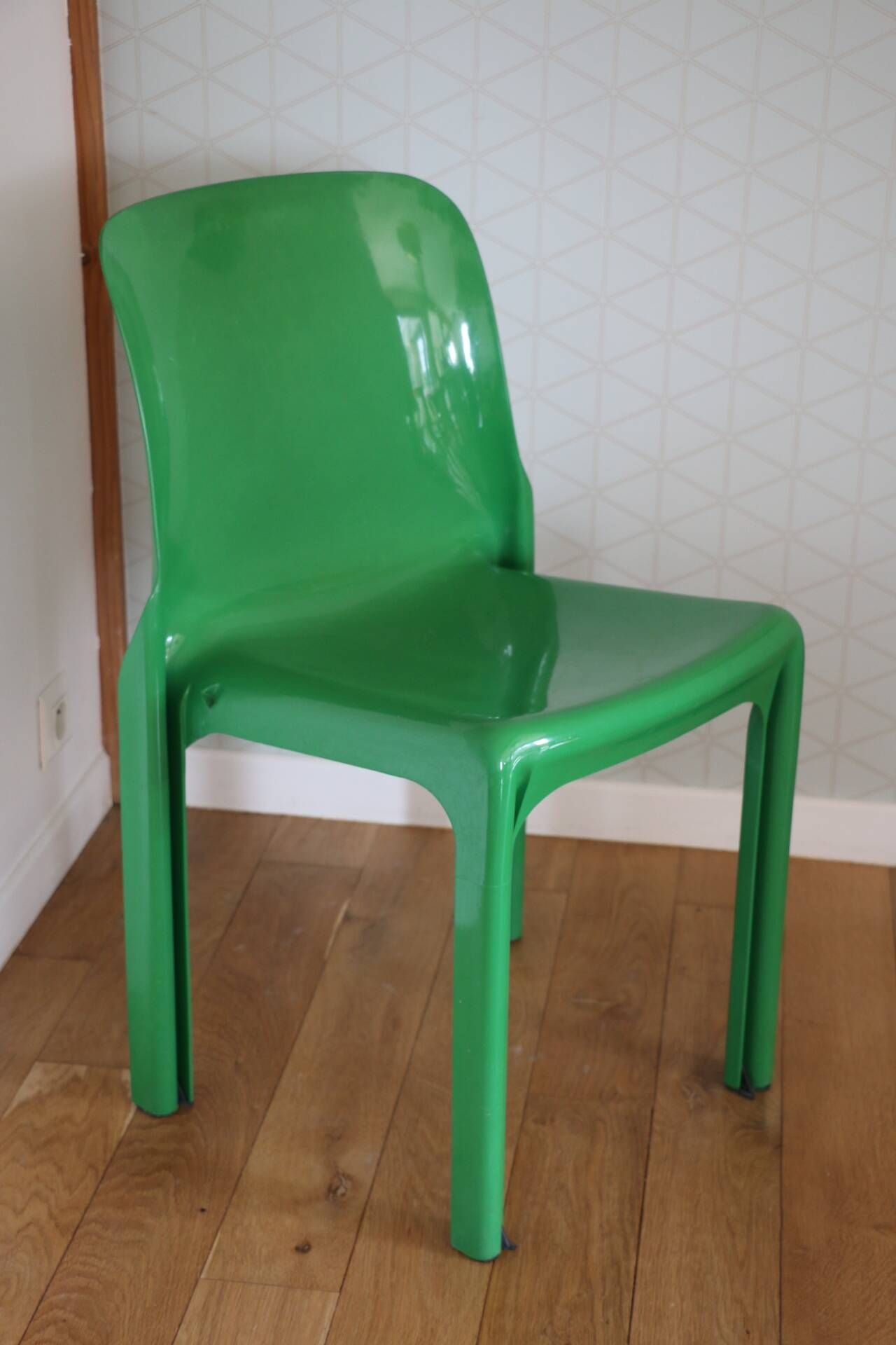 Set of 4 green Selene Magistretti chairs.