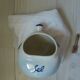 Ceramic salt pot and wooden spatula