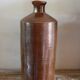 Vintage Bourne Deney stoneware liqueur bottle with pouring spout.