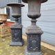 Large antique cast iron vases on pedestal
