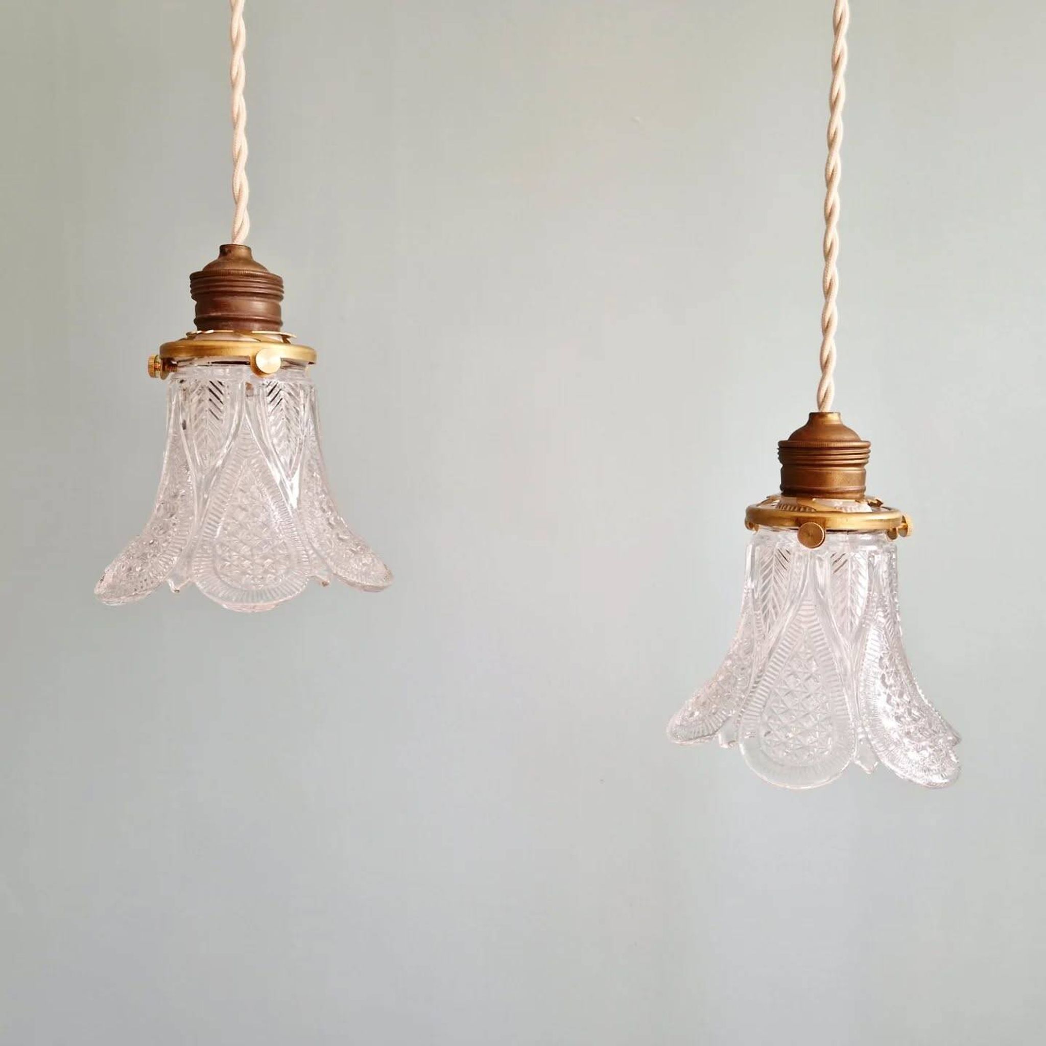 Art Deco trio of pendant lights/table lamps in clear glass, 1920s-30s.