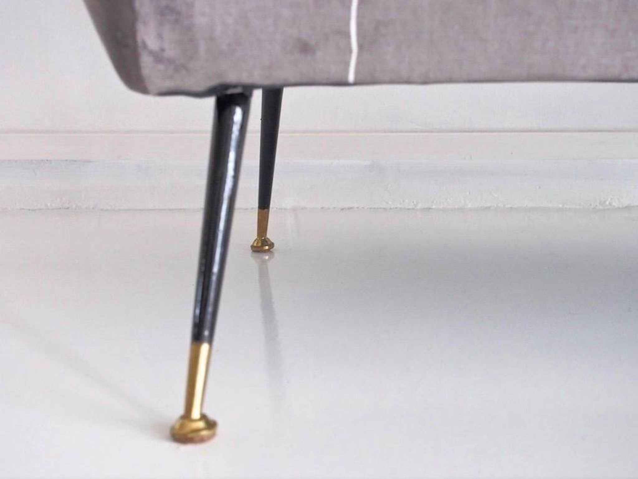 Italian velvet sofa in grey with black lacquered brass legs.