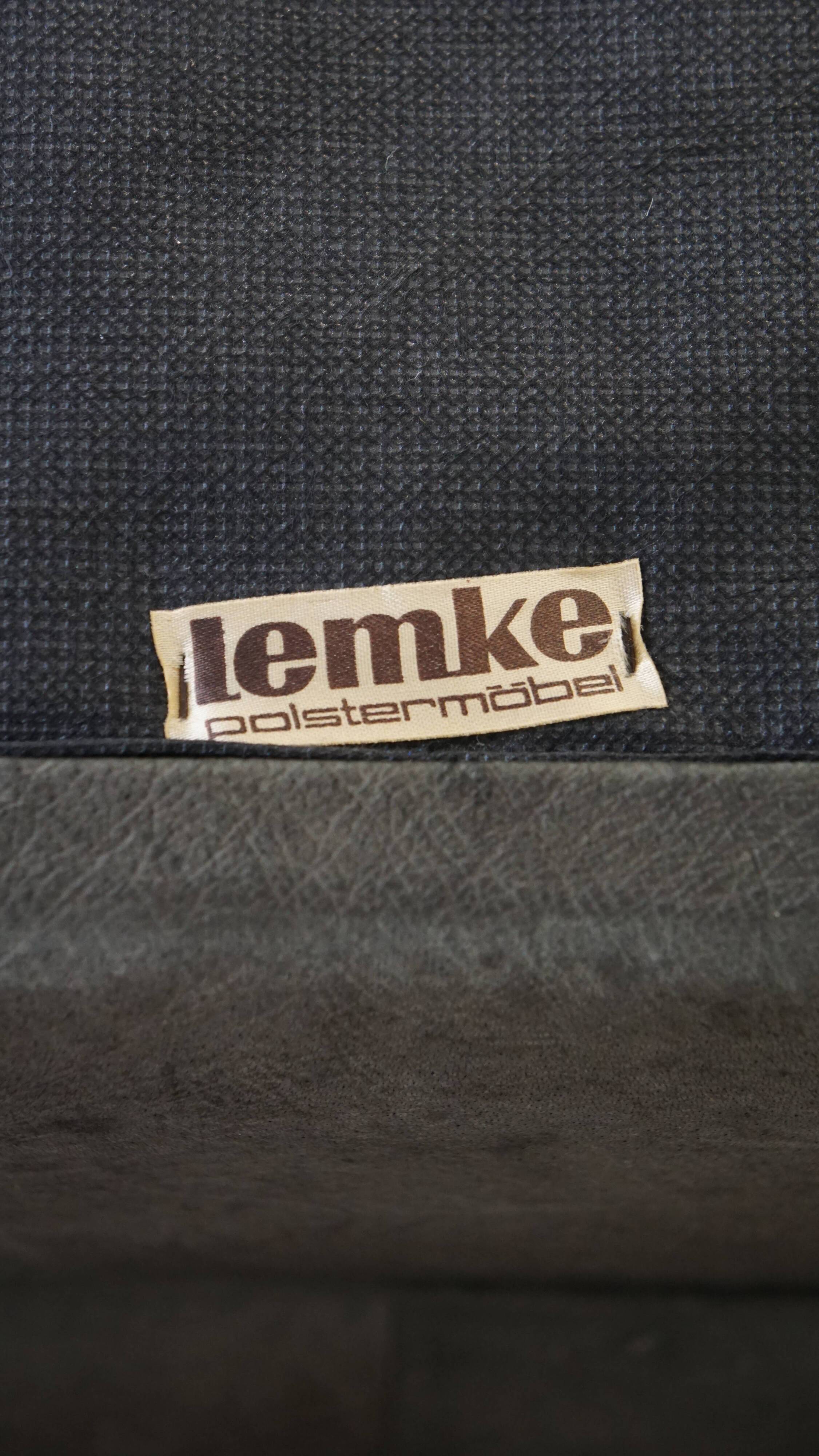 Canapé design modulable en cuir gris, 3 modules et 1 repose-pieds