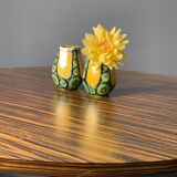 A pair of green and yellow vases