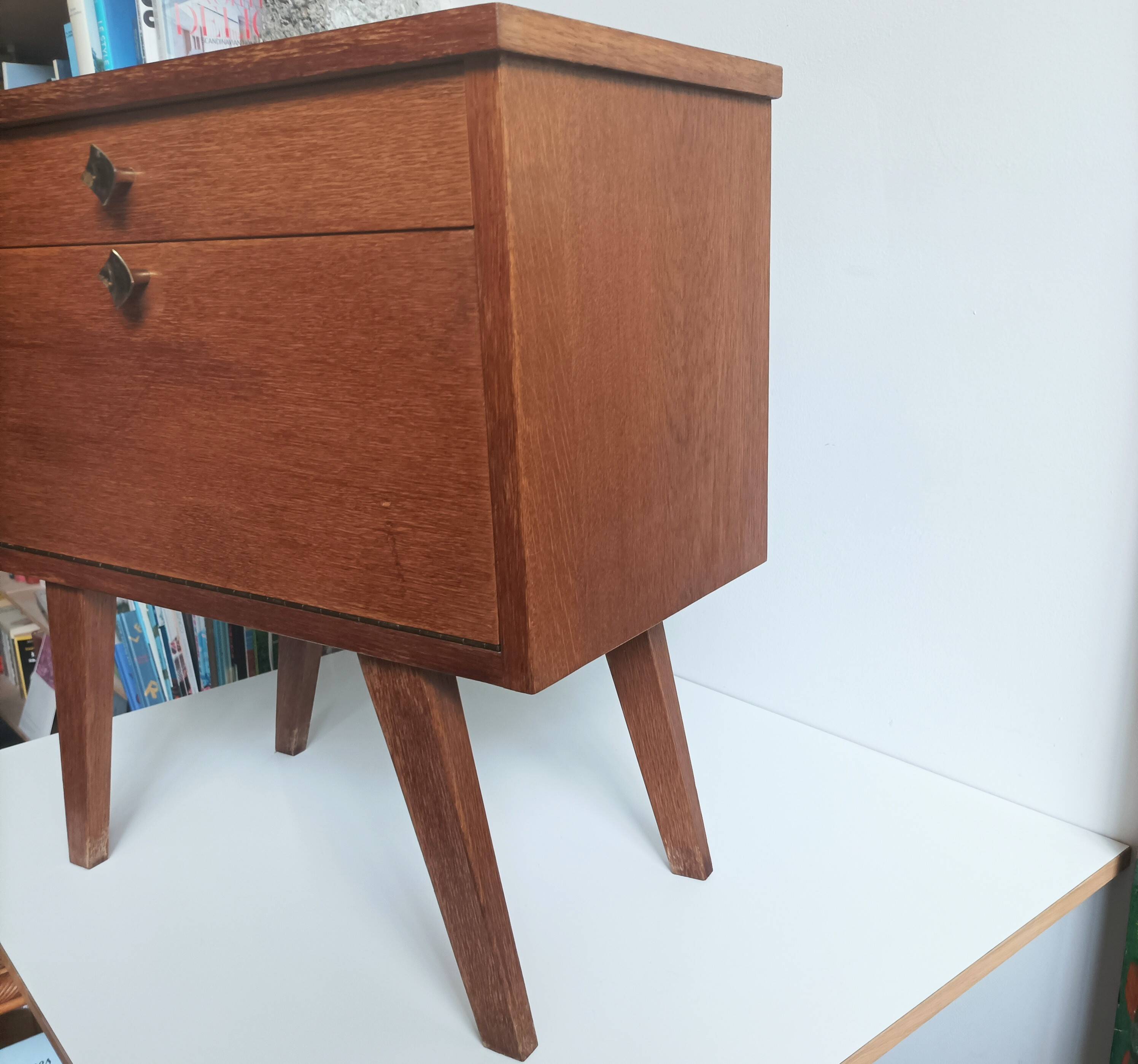 Wooden bedside table with vintage compass legs