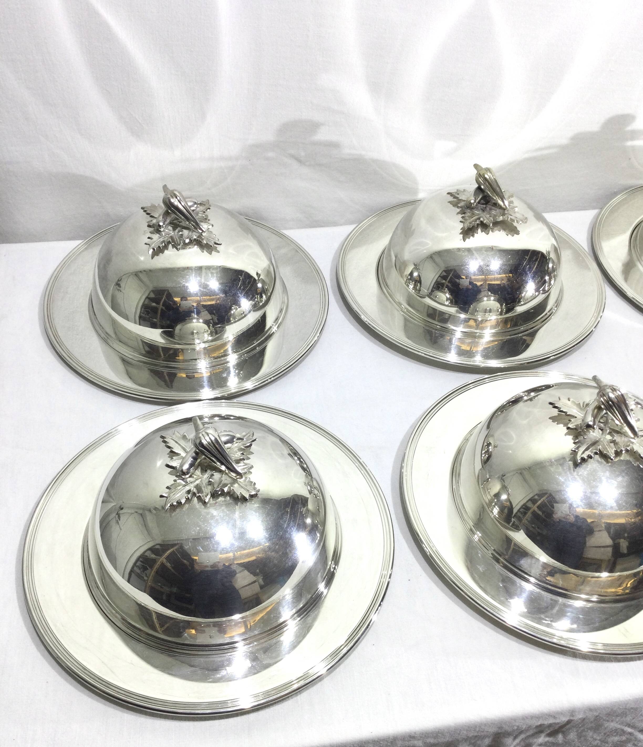 Set of silver-plated serving dishes and bells