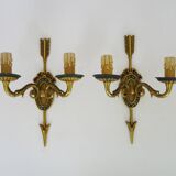 Pair of double-light Empire style arrow wall lights in bronze. Early 20th century