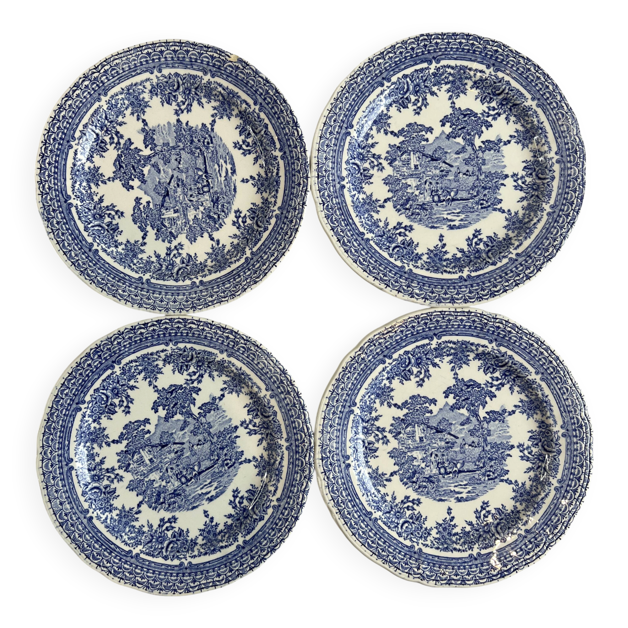 Set of four flat plates from English earthenware.