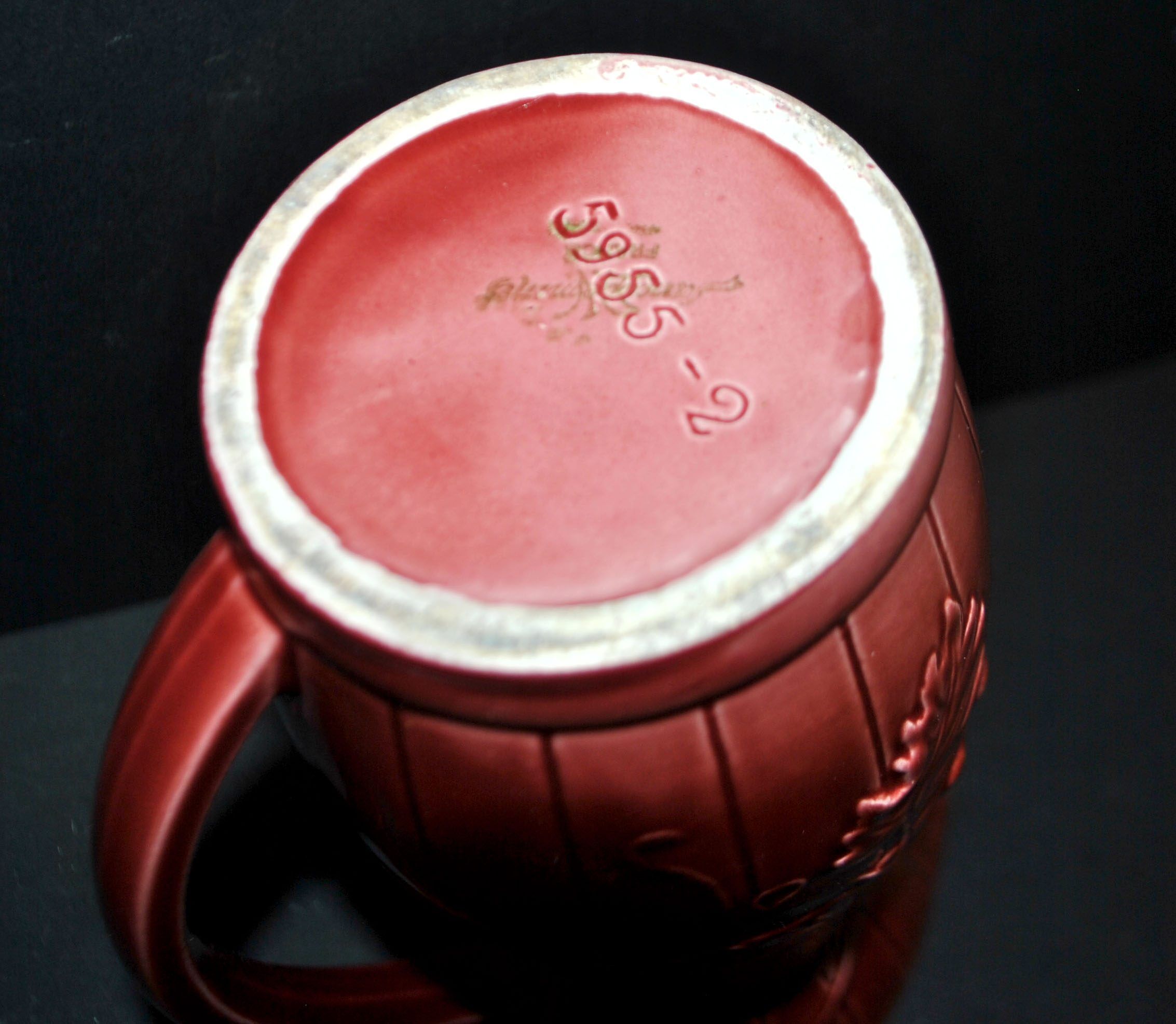 Sarreguemines wine jug in red slipware with grapevine decoration.