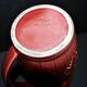 Sarreguemines wine jug in red slipware with grapevine decoration.