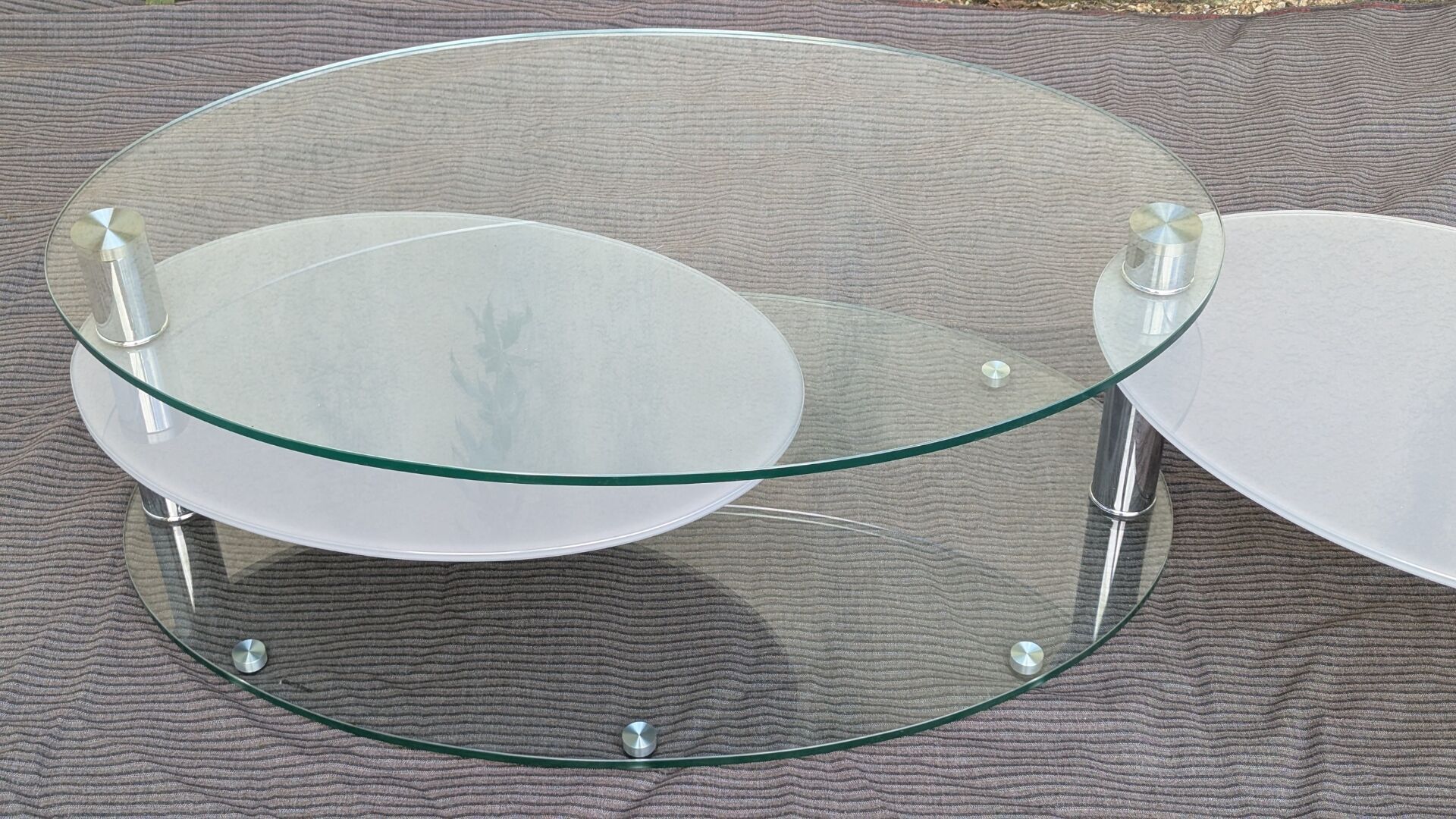 Coffee table with rotating glass tops by Antoine Motard.