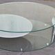 Coffee table with rotating glass tops by Antoine Motard.