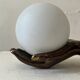 Vintage table lamp hand-crafted in bronze with an opaline globe, Maison Arlus 1970.
