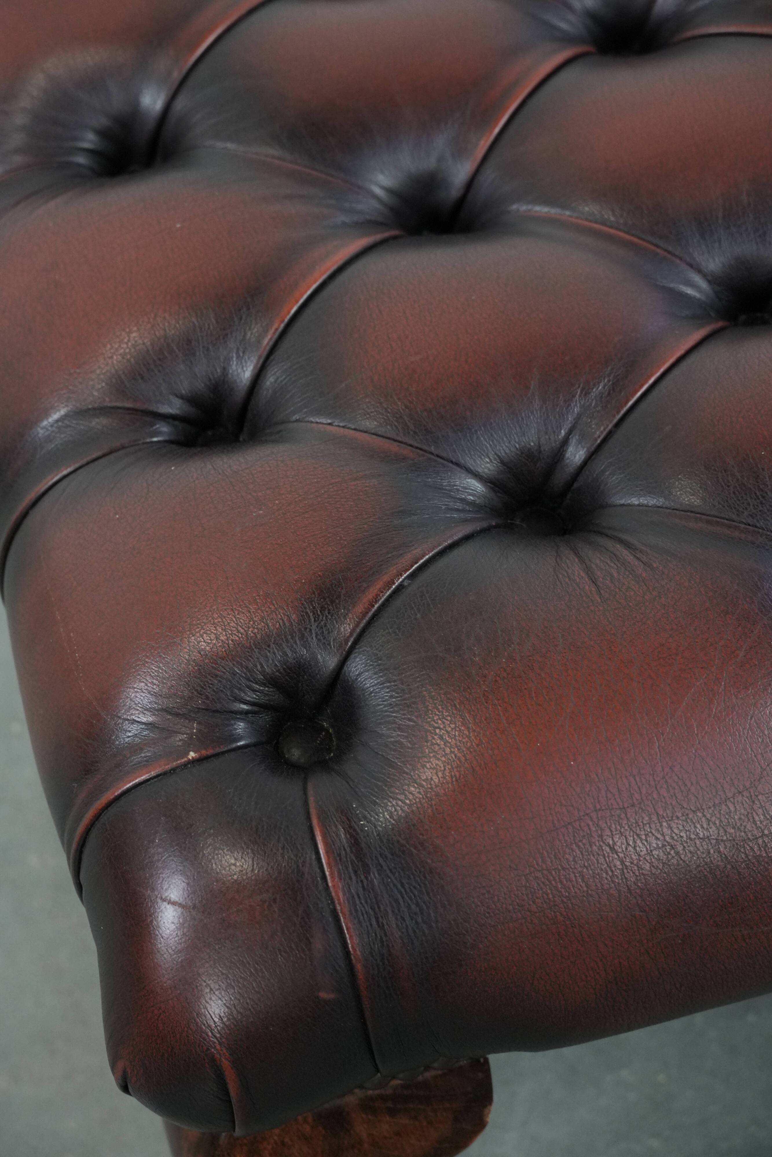 Dark brown chesterfield ottoman in cowhide leather