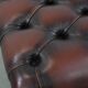 Dark brown chesterfield ottoman in cowhide leather