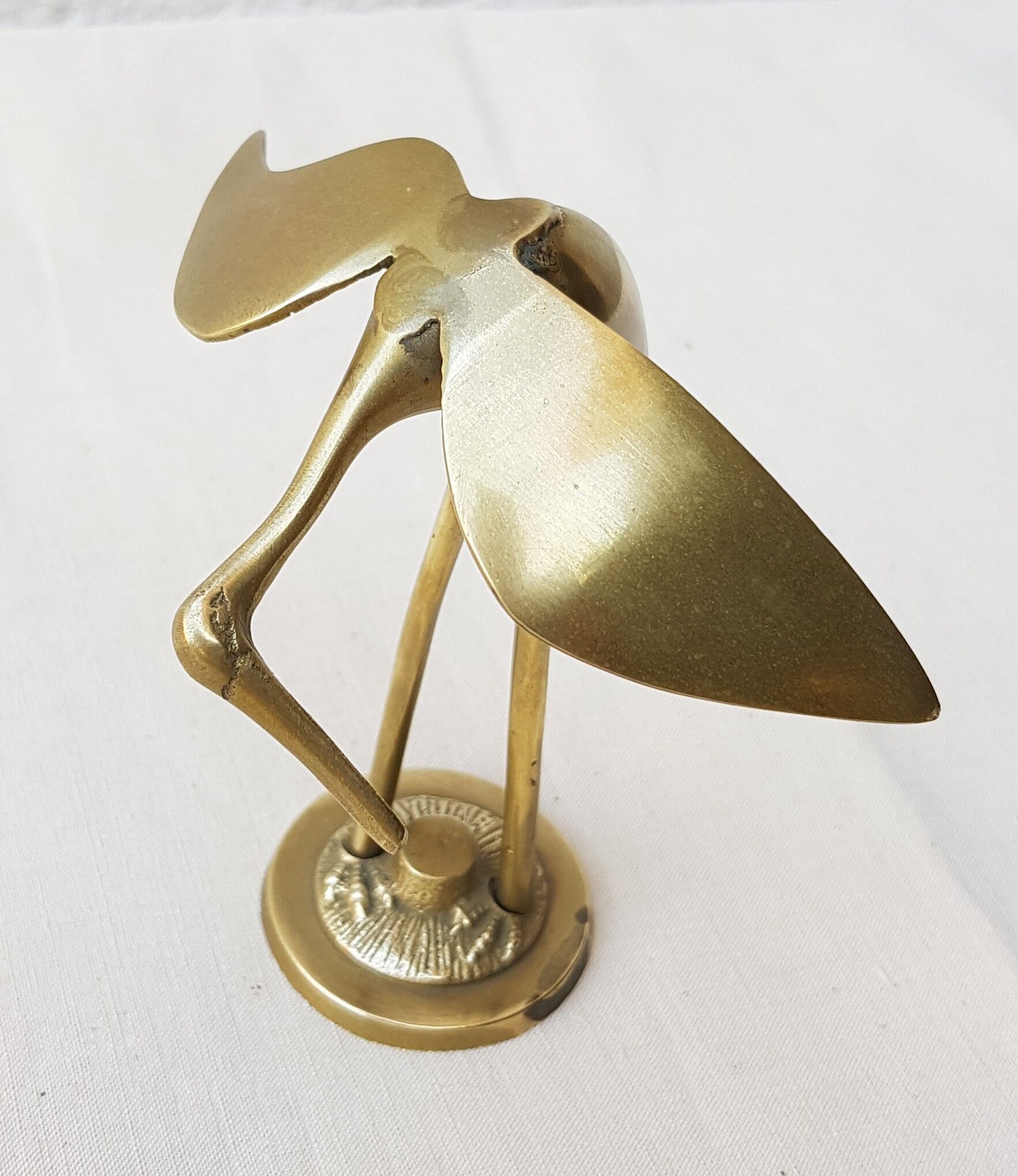 Small brass heron