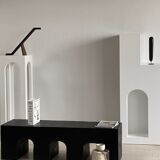 Black solid monoxyl wood bench carved into 3 arches