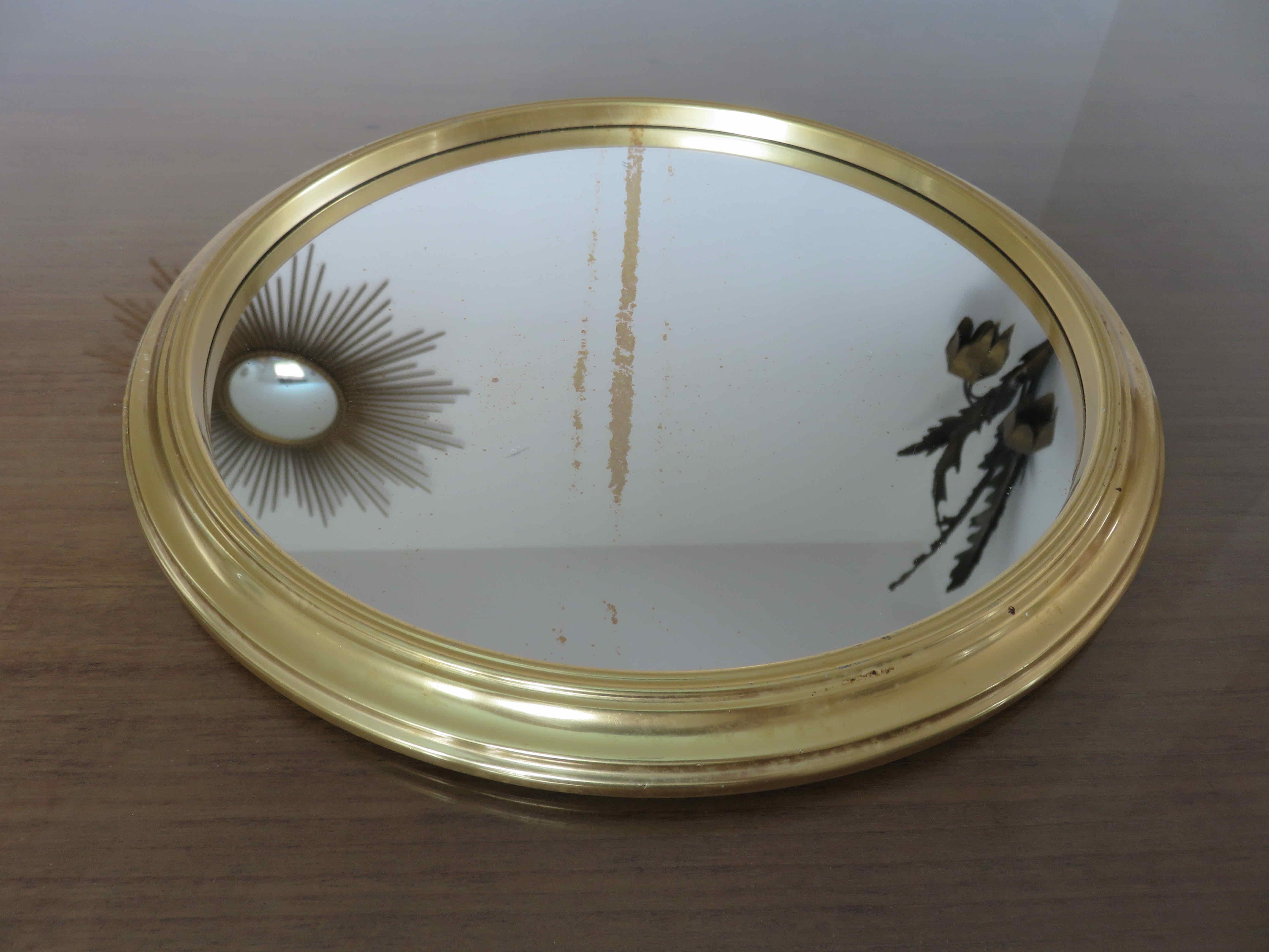 Round mirror top in gilded aluminum art deco