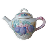 Old ceramic teapot in the shape of a basket of fruits from the garden