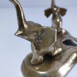 Solid brass elephant pocket emptier from the 80s