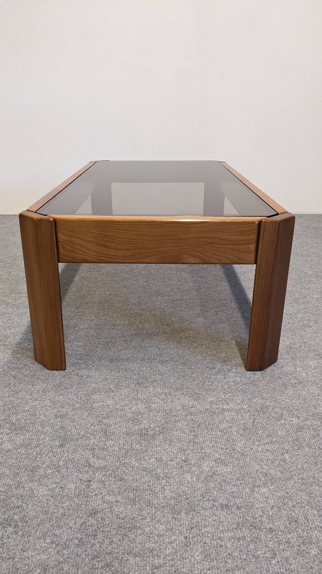 Modernist coffee table in elm and smoked glass, Italy circa 1970.