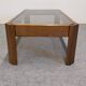 Modernist coffee table in elm and smoked glass, Italy circa 1970.