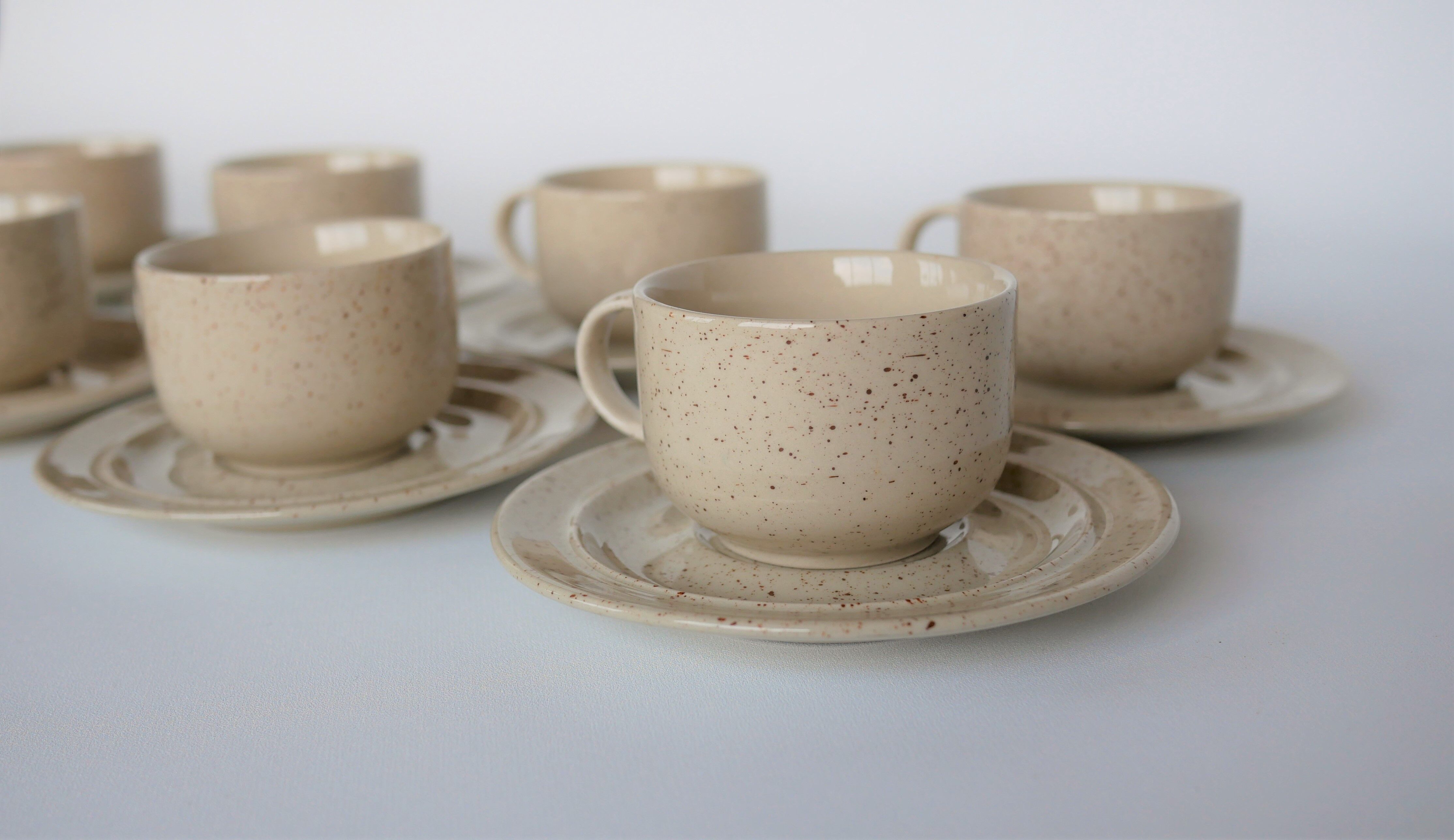 Coffee cup and vintage pyrity sandstone subcup