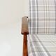 Vintage armchair and beige blue tartan footrest modern design