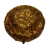 Old brass and copper powder magazine decorated with cherubs