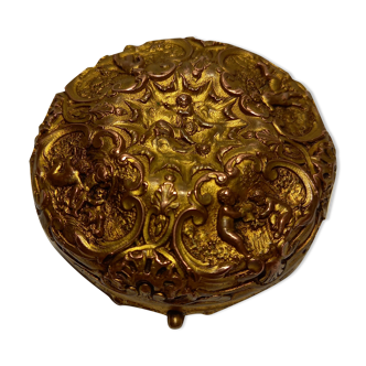 Old brass and copper powder magazine decorated with cherubs