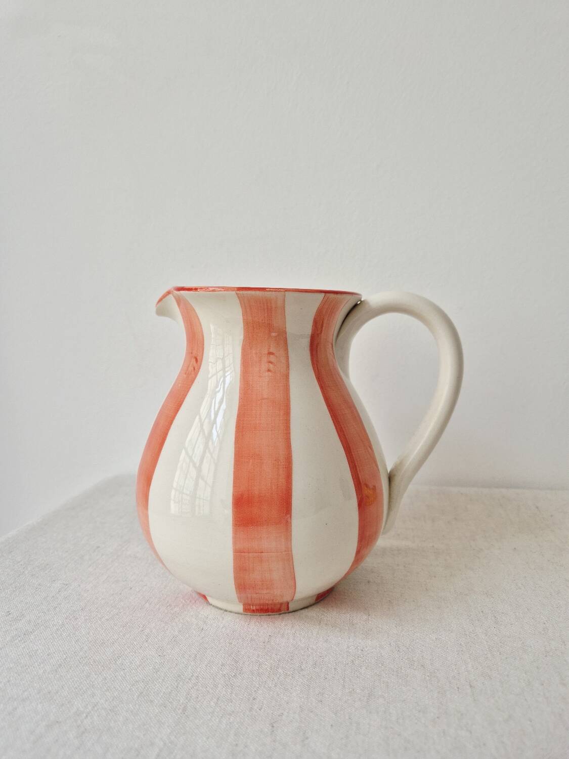 Vintage ceramic vase/pitcher with handmade mandarin stripes.