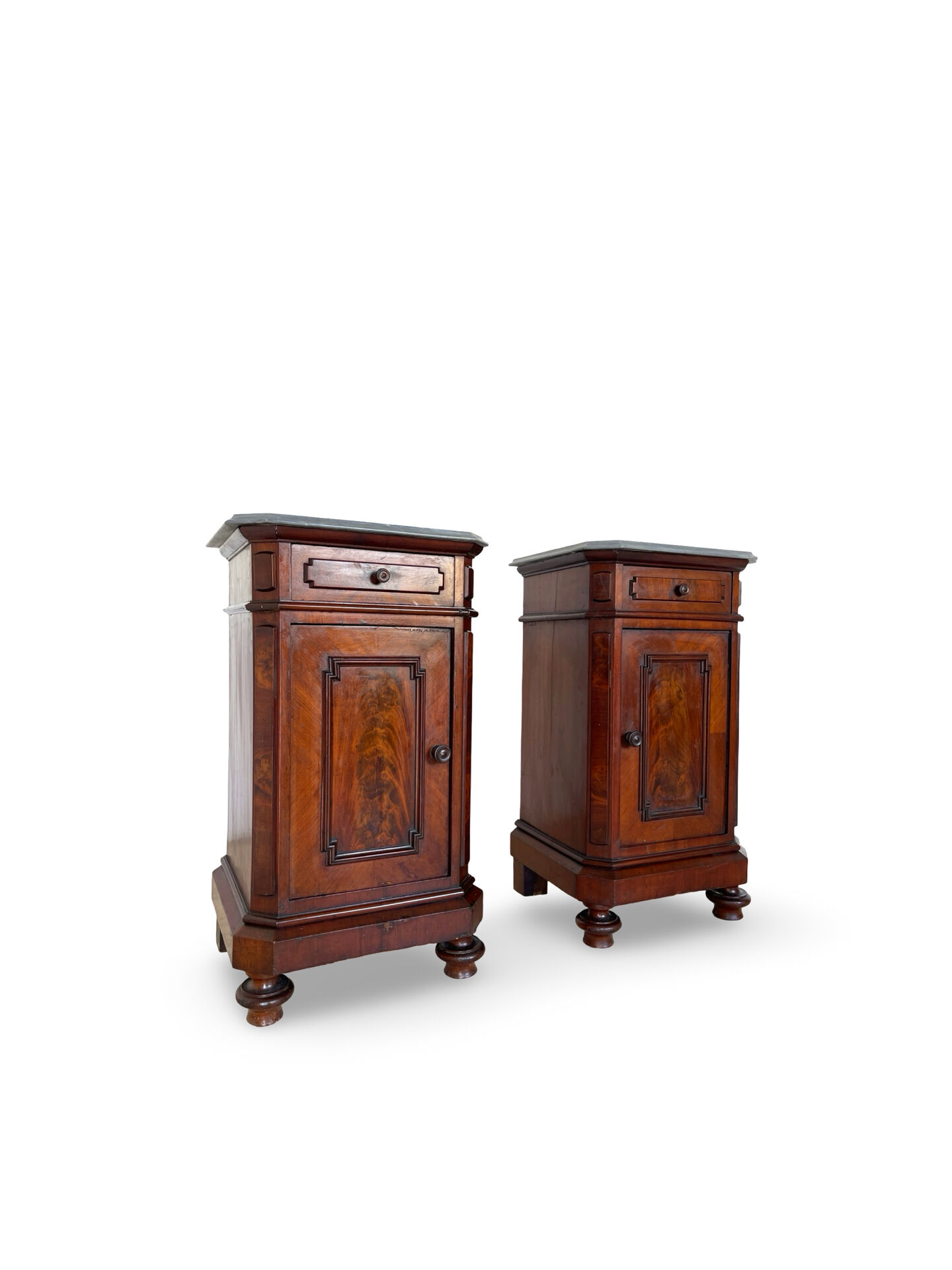 A pair of antique walnut bedside tables from the 1890s.