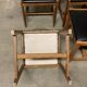 Set of four vintage chairs upholstered in retro design faux leather.
