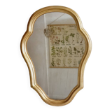 Free form mirror in golden wood