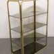 Hollywood Regency gilt metal and smoked glass shelf, Italy circa 1970