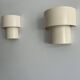 Pair of vintage modernist wall lights, white lacquered metal, Sweden 1970