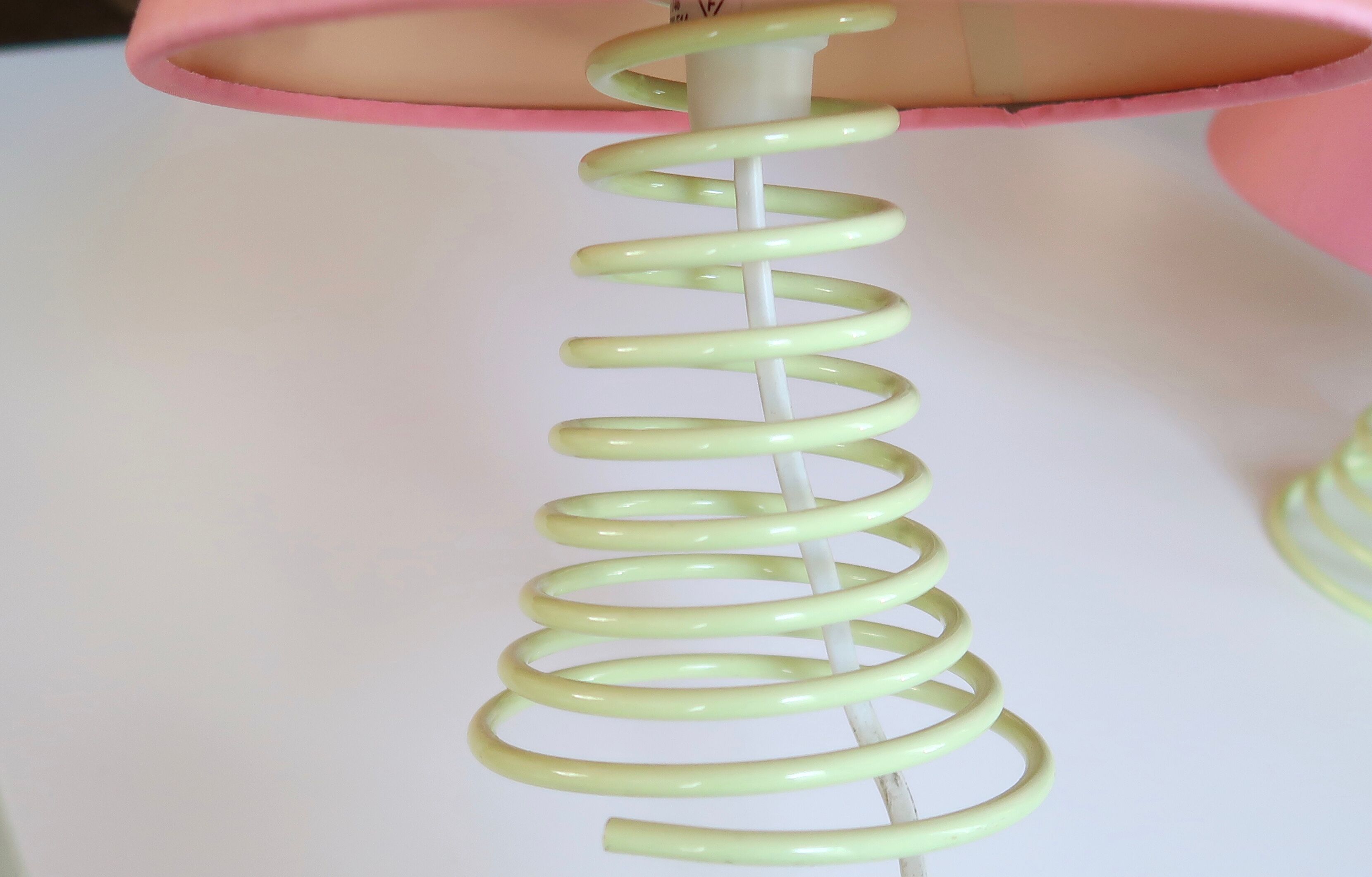 Pair of lamps, yellow spring foot, pink lampshade, 90s