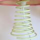 Pair of lamps, yellow spring foot, pink lampshade, 90s