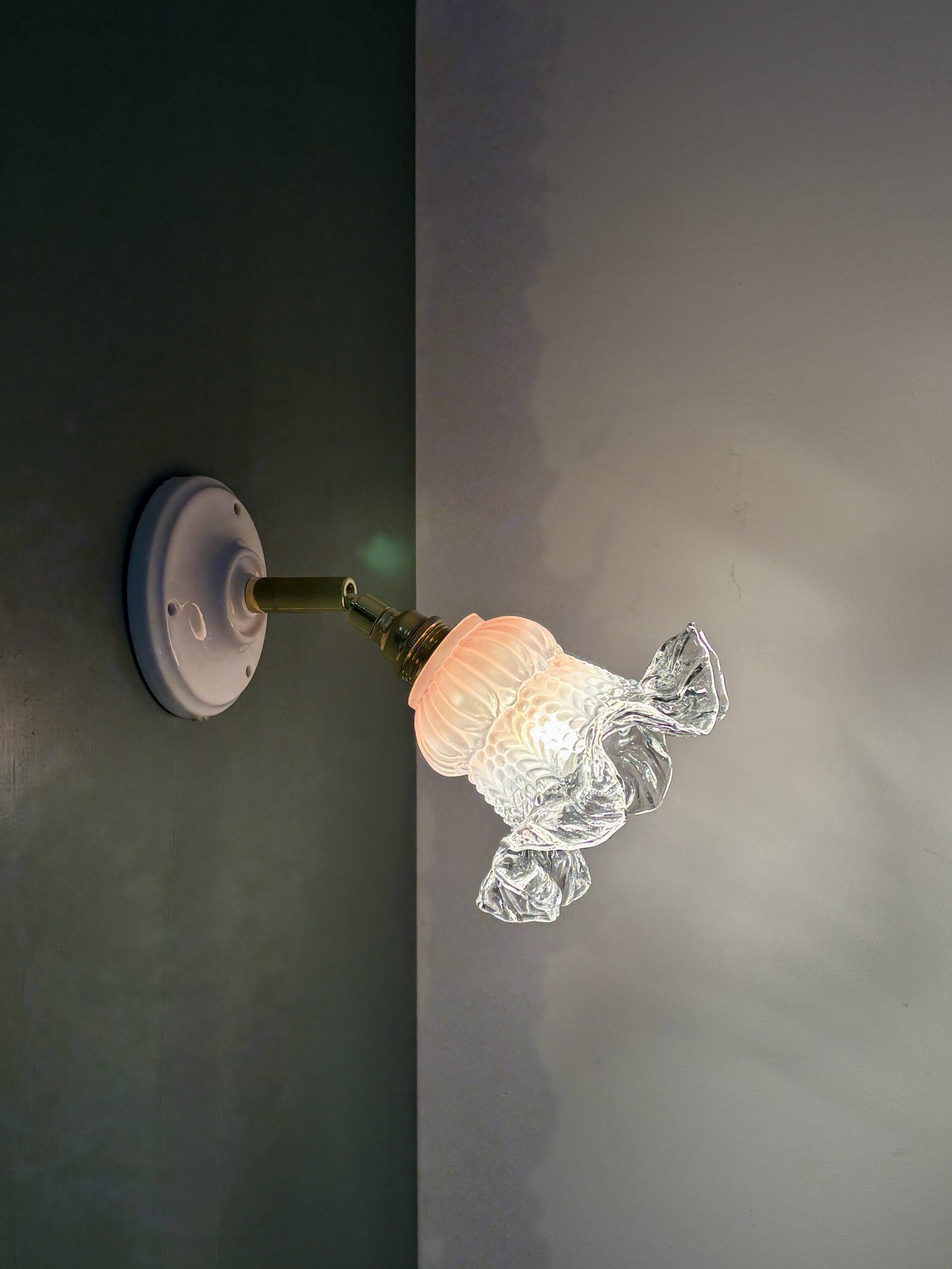 Vintage pink and clear glass tulip wall light.
