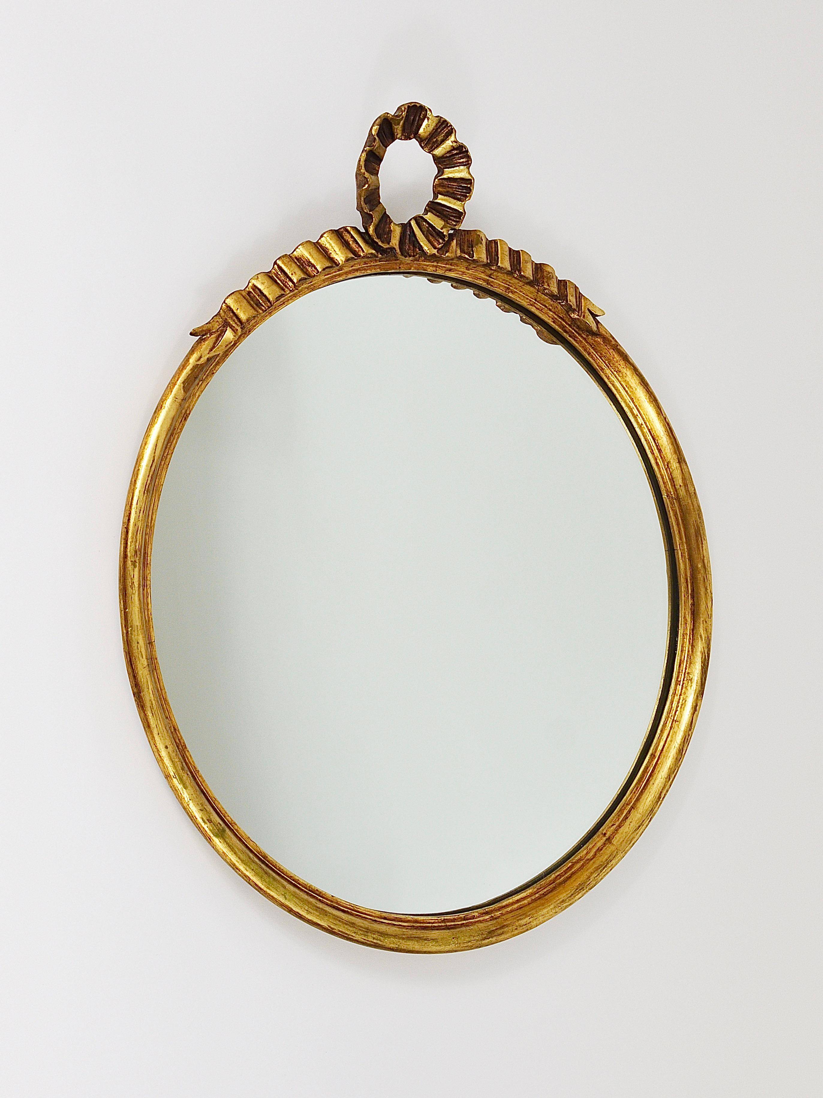 Round wall mirror in gilded wood, mid-century, C. Allodi & G. Subelli, Italy, 1950s.