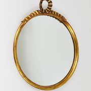 Round wall mirror in gilded wood, mid-century, C. Allodi & G. Subelli, Italy, 1950s.