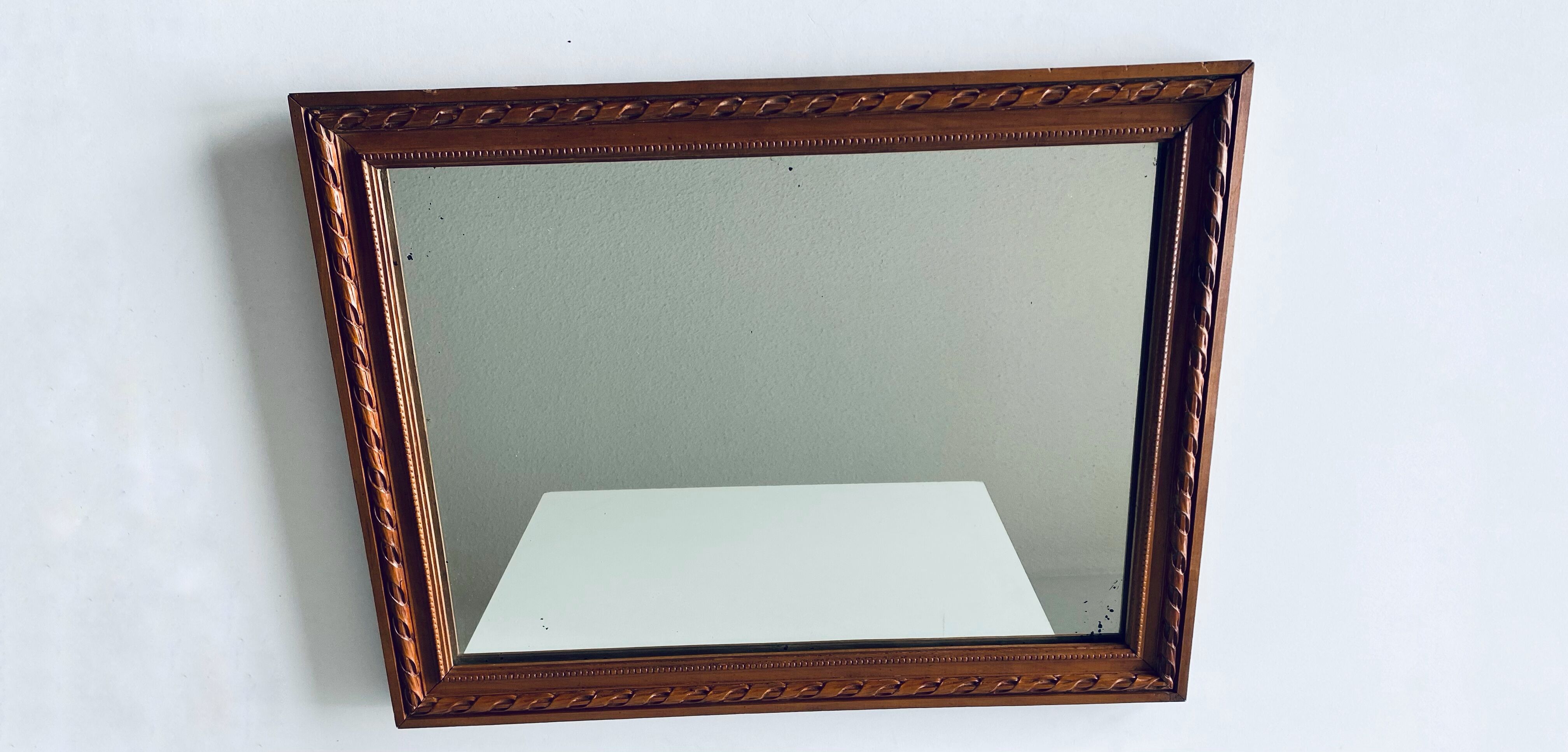 Antique mirror in carved wood and mercury 48x63cm